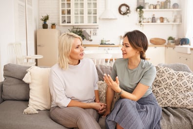 ladies chatting on couch about breast cancer facts 