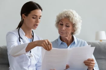 WVCI oncologist with patient discussing ovarian cancer treatment options